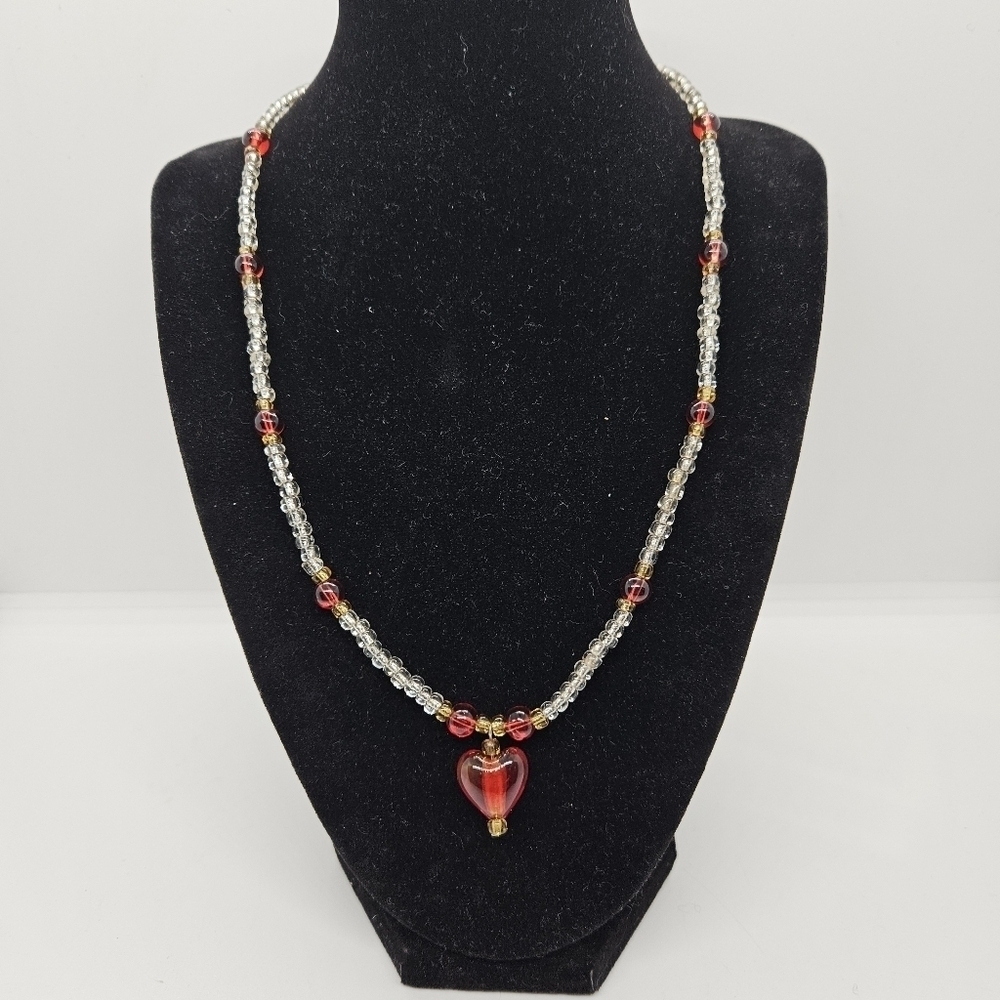 clear and red glass bead necklace with heart pendant